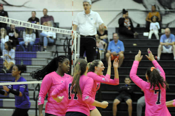 Lake Nona's Emma McDonald (8) celebrates a kill with teammates (from left) Dakota Jean-Louis, Anna Pantano and Jarielys Giraud. McDonald had five kills and two blocks.